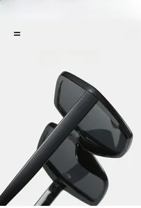 Detail view of lightweight elastic black hexagonal sunglasses frame and metallic hinges