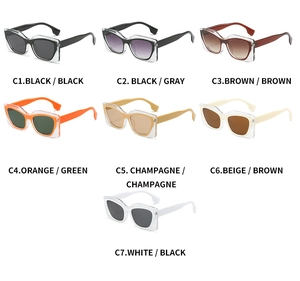 Flat lay of cat-eye sunglasses in seven assorted color frames and tinted lenses