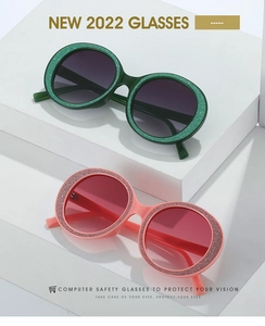 Detailed view of round glitter frames and protective lenses on stylish 2022 sunglasses