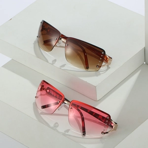 Retro oversized rimless sunglasses with rhinestone accents and gradient lenses