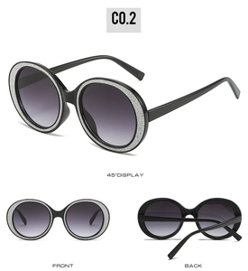 Three-angle view of round oversized sunglasses with silver glitter frame and grey gradient lenses