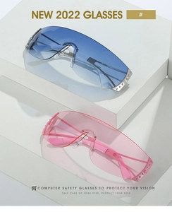 Detail view of rimless Y2K sunglasses with gradient lenses and rhinestone accents