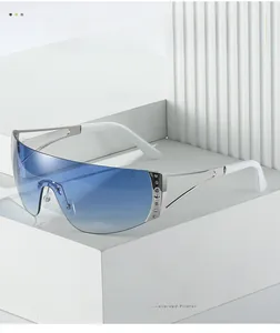 Detail of frameless Y2K blue gradient sunglasses with star metal studs on white geometric stand
