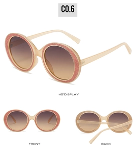 Detail view showing round champagne frames with pink glitter accents and gradient lenses