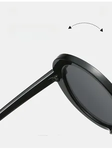 Detail of durable metal reinforced hinge on high-quality black round sunglasses