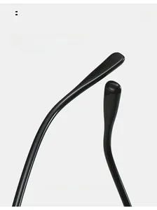 Detail of curved ergonomic temples on glossy black sunglasses for comfortable wear