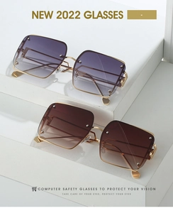 Detail of square rimless sunglasses showing gradient lenses and geometric gold temples