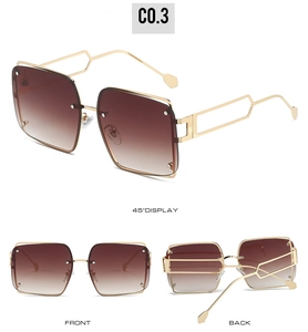 Detail view of square rimless sunglasses with gold geometric hollow temples and brown lenses