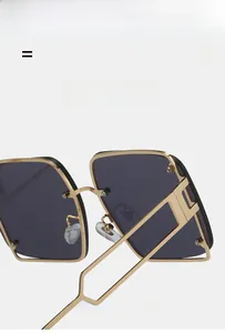 Detail of square gold metal sunglasses frame with ultra-light hollow hinge design