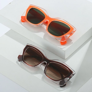 Chic cat eye sunglasses with trendy transparent thick frames and colorful inner layers