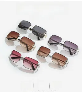 Detail view of rimless square sunglasses set with various gradient lenses and C-diamond trim