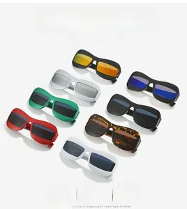 Flat lay of colorful frog-eye sunglasses featuring oversized frames and various lens colors