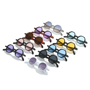 Multiple vintage small frame polygonal sunglasses in various vibrant colors for a retro look