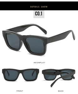 Detail view of bold black rectangle sunglasses with dark gray polarized lenses for unisex style