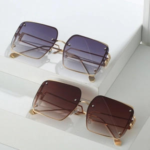 Square rimless sunglasses with gradient lenses and silver rivet accents in gold metal frame
