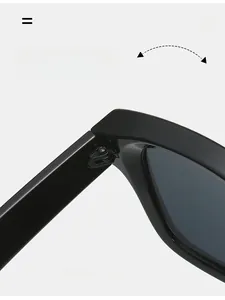 Macro shot of durable texture hinge on black oversized sunglasses with metal accents
