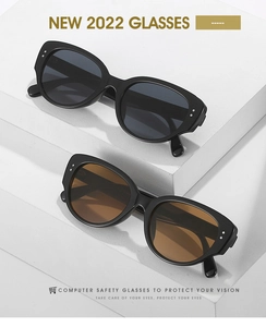 Detail of vintage cat-eye sunglasses featuring silver studs and stylish gradient frames