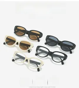 Flat lay of retro cat-eye sunglasses with silver stud accents and multi-color lenses