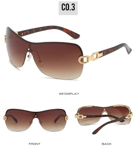 Detail view of oversized wrap-around sunglasses with tortoiseshell temples and gold chain