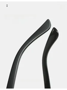 Detail showing curved mirror legs design of the glossy black wraparound sunglasses