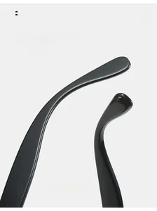 Detail view of glossy black curved temple tips for comfortable ergonomic sunglasses wear