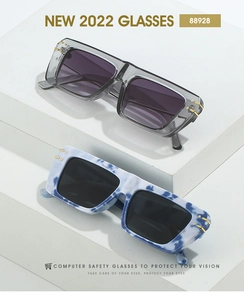 Detail of square sunglasses with gold metal bar accents on blue marble and grey frames