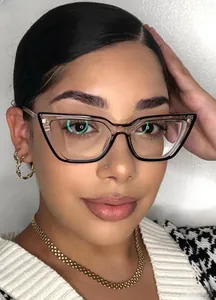 Close-up of cat eye glasses with black and white contrast frame and metal spring legs
