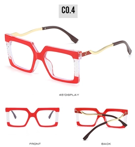 Detail view of large square frames with red diamond texture and golden wavy temples