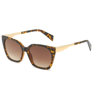 Classic tortoiseshell square sunglasses with gold metal temples and brown gradient lenses