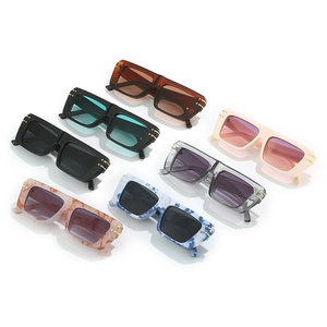 Collection of retro flat top square sunglasses in various colors with gold metal accents
