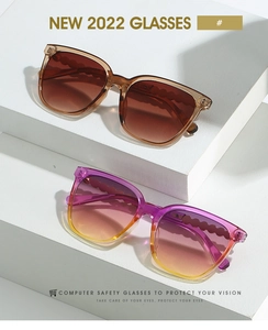 Detail of amber and gradient purple square sunglasses with textured wavy temples