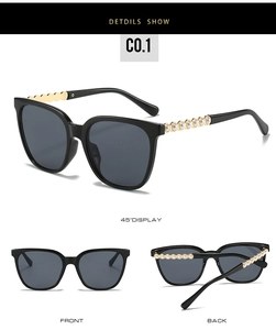Detailed side view of cat eye sunglasses with pearl and gold wavy metal temples