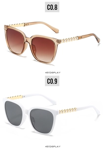 Detailed 45-degree view of cat eye sunglasses with metal pearl temples and gradient lenses
