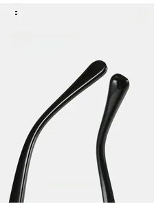 Detail of ergonomic curved black temple tips on cat-eye sunglasses for comfortable wear