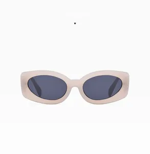Detail view of stylish small frame jelly white sunglasses with dark grey lenses