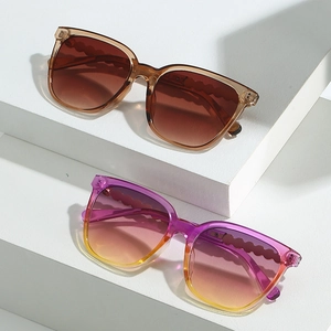 Fashion cat-eye sunglasses with gradient lenses and unique wavy textured temples in two colors