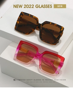 Detail view of square oversized sunglasses in tortoiseshell and pink gradient frames