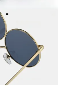 Detailed macro view of lightweight gold metal frames and elastic temples of sunglasses