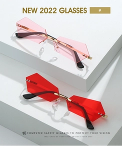 Detail of rimless geometric sunglasses with gradient lenses and gold metal temple accents