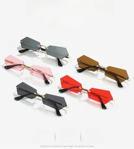 Detail of five colored rimless geometric sunglasses with faceted edges and gold temples