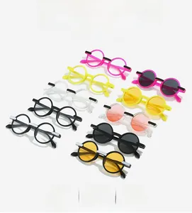 Flat lay of retro round sunglasses in multiple colors with stylish top bar design