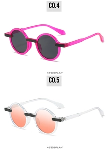Detailed 45-degree view of round retro sunglasses in rose pink and transparent frames