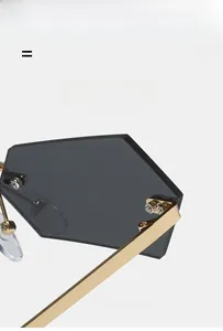 Detail of the golden hinge on frameless gradient sunglasses with high elasticity