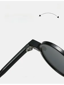 Detail of durable metal hinges on oversized round sunglasses for smooth folding