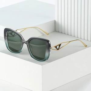 Lunettes de soleil œil de chat vintage avec monture dégradée et branches en métal doré