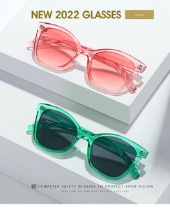 Détails de lunettes d'ordinateur œil de chat stylées en dégradé rouge-rose et monture verte