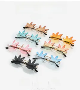 Detailed top view of various colorful leaf-shaped rimless sunglasses with metal frames