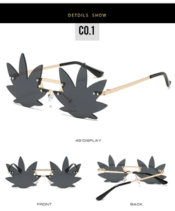 Macro detail of rimless gold metal sunglasses with dark gray maple leaf shaped lenses