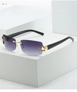 Detail of rimless square sunglasses with gradient purple lenses and gold star accents