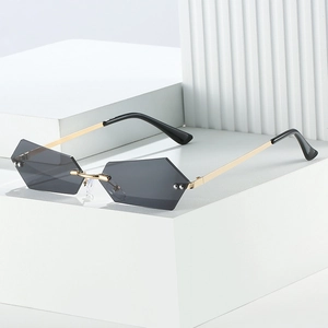 Rimless geometric sunglasses with gradient lenses and gold metal temples in minimalist style